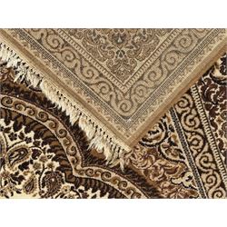Persian Tabriz ivory ground rug, the field centred by a shaped floral medallion with swirling spandrels, richly decorated with foliate motifs, the broad border with matching cartouches and palmettes, within multiple guard stripes