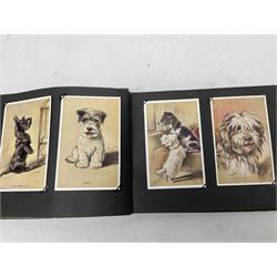 Three albums of cigarette cards including Wills Recruiting Posters, Military Motors and Allied Army Leaders, cricketers etc; another album containing a large quantity of laid-in cigarette cards; and an album of thirty-seven postcards of dogs by Mac (5)
