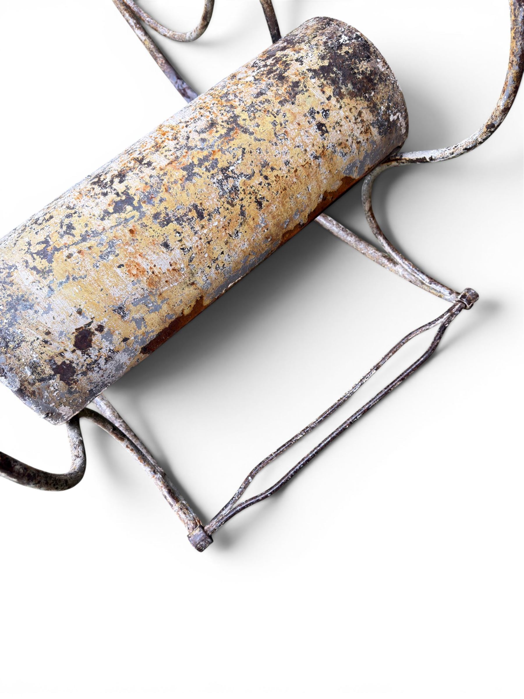 Pair of large unusual 19th century wrought iron garden rocking chairs, simple scroll design, lacking canvas seat