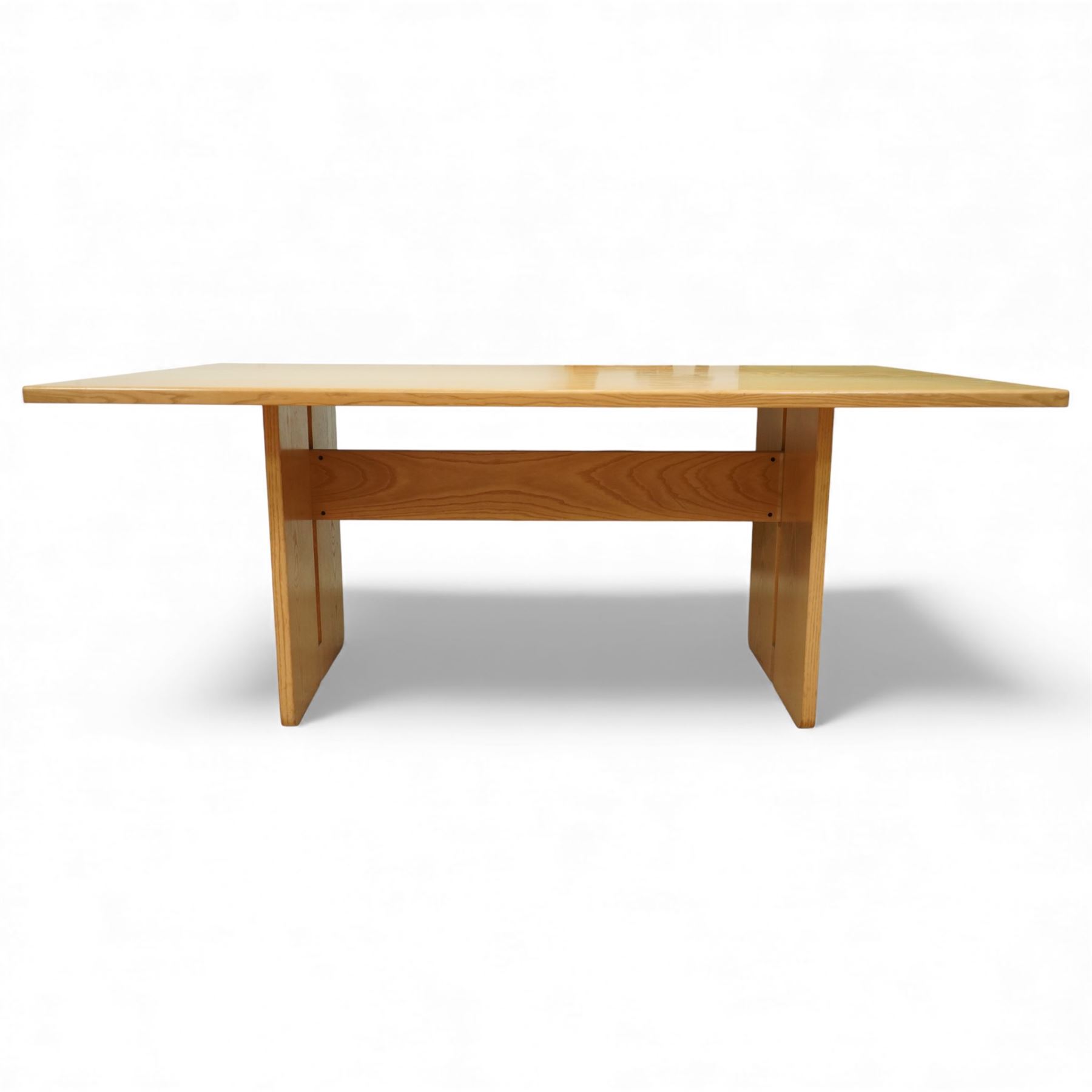 Heals - oak veneered dining table, with rectangular plain-surfaced top on twin slab end supports incorporating central cut-outs