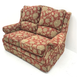 Rutland two seat sofa upholstered in a red ground fabric with floral pattern, W144cm
