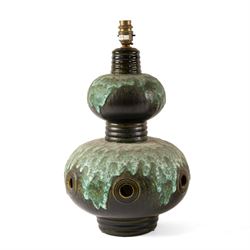 West German Pottery - two mid 20th century ceramic lamp bases, brown glaze with petal style decoration and pierced detail, together with another similar with volcanic glaze, largest H52cm