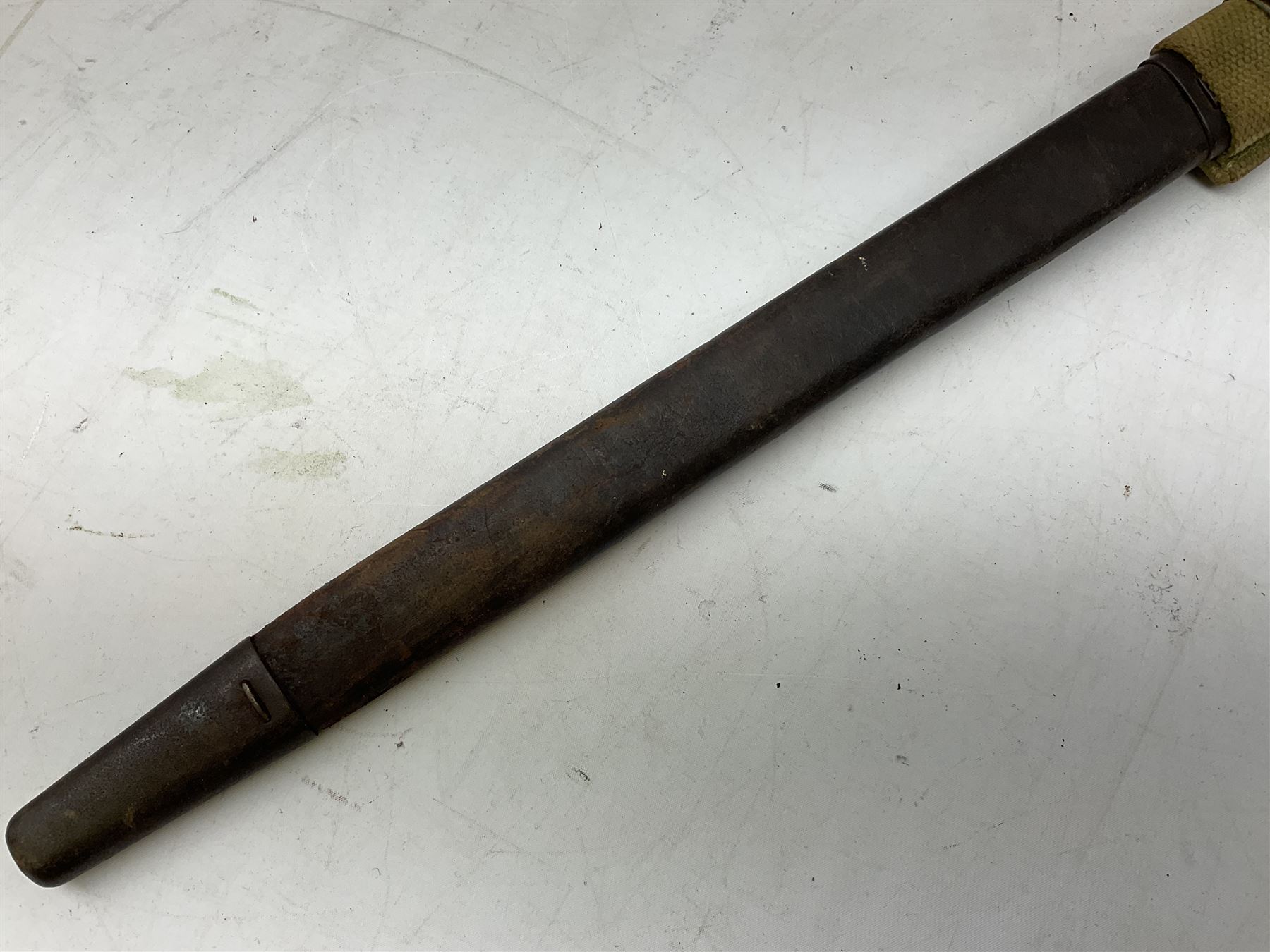 British Pattern 1907 bayonet with 43.5cm fullered steel blade; in leather scabbard with webbing frog L58cm overall; another Pattern 1907 bayonet lacking scabbard; and British Pattern 1888 Mk.I bayonet by Wilkinson London (no scabbard) (3)