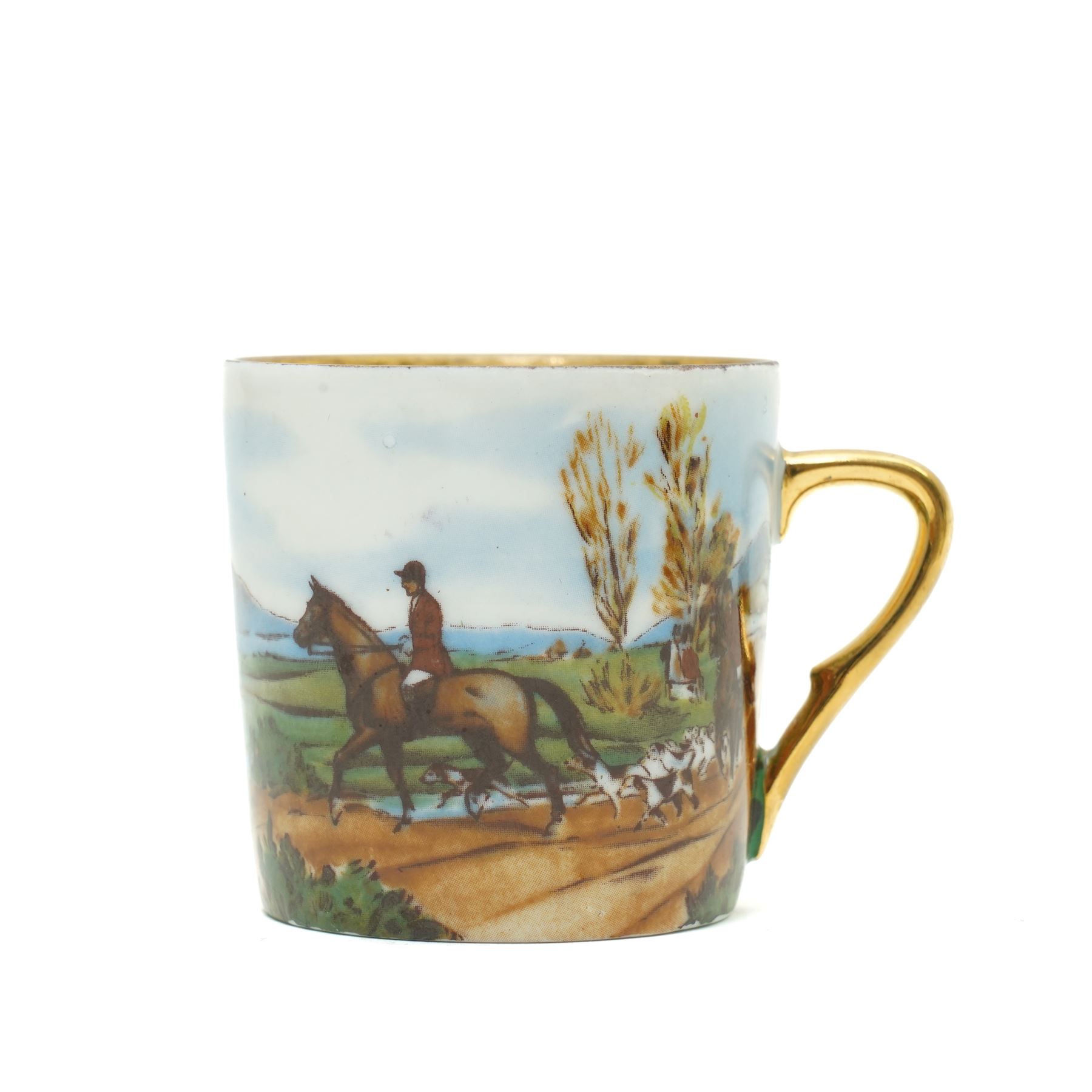 Limoges  coffee set decorated with hunting scenes within a gilt border comprising twelve cups and saucers, coffee pot, cream jug and sugar bowl
