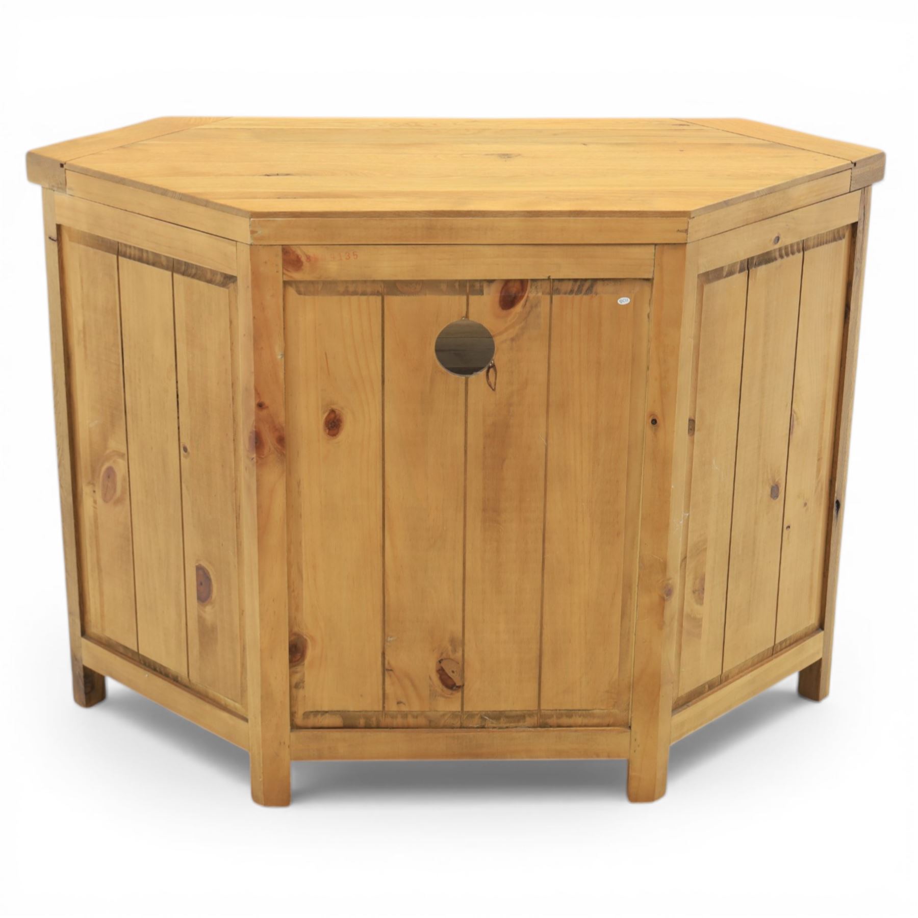 Modern light oak corner television stand, open recess above two cupboard doors with aperture to the back