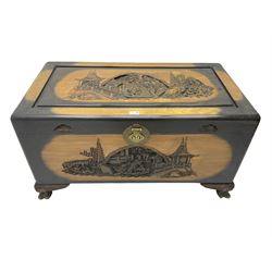 Singapore camphor wood blanket chest, rectangular hinged top with carved panel depicting traditional pagoda and river scenes