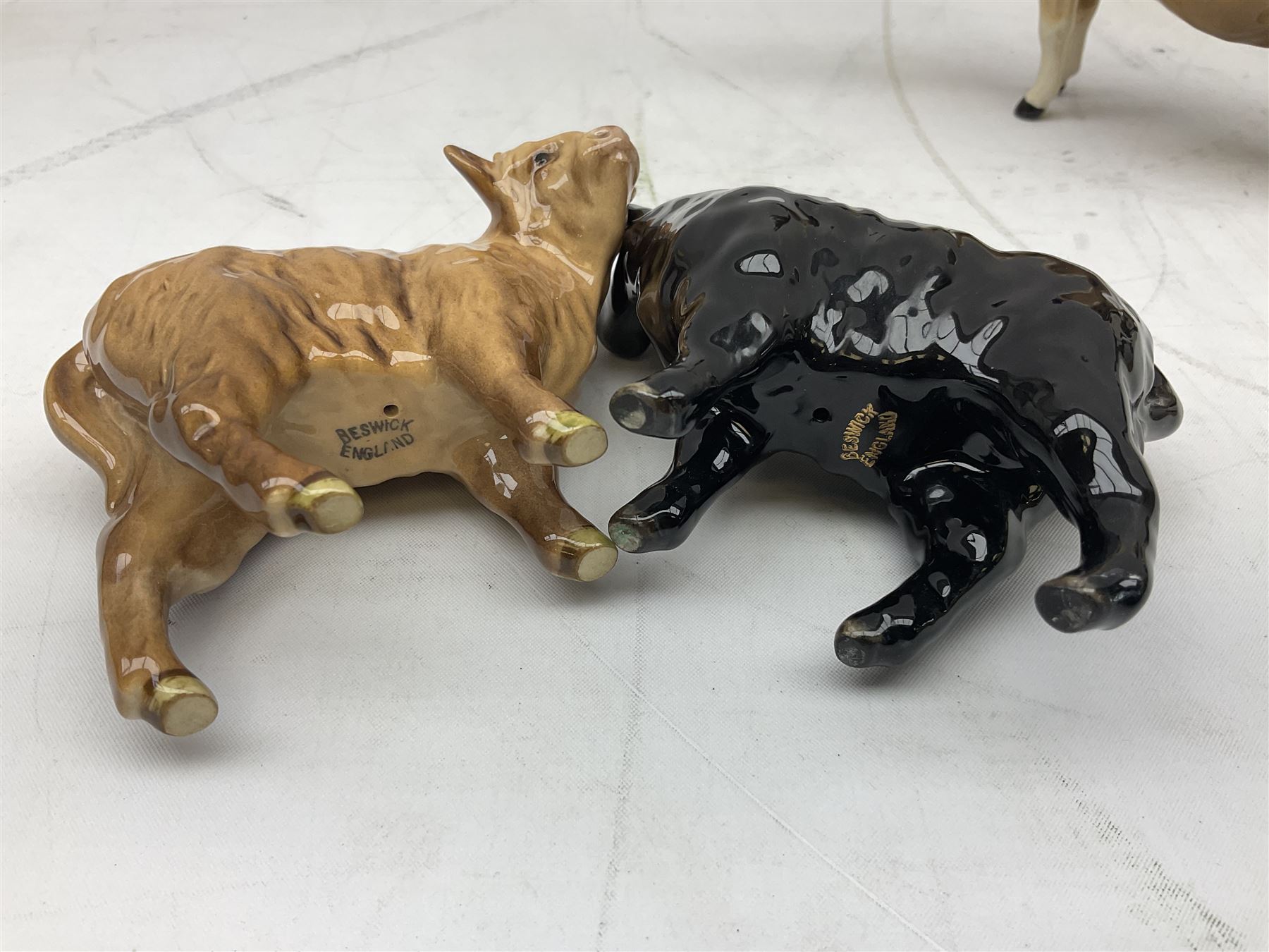 Seven Beswick cow figures, to include Friesian bull Ch. ''Coddington Hilt Bar'' no. 1439a, Friesian cow Ch. 'Claybury Leegwater' no. 1362a and Friesian calf no. 1249C, Aberdeen Angus calf 1827a, Jersey cow no. 1345 etc, all with printed mark beneath  