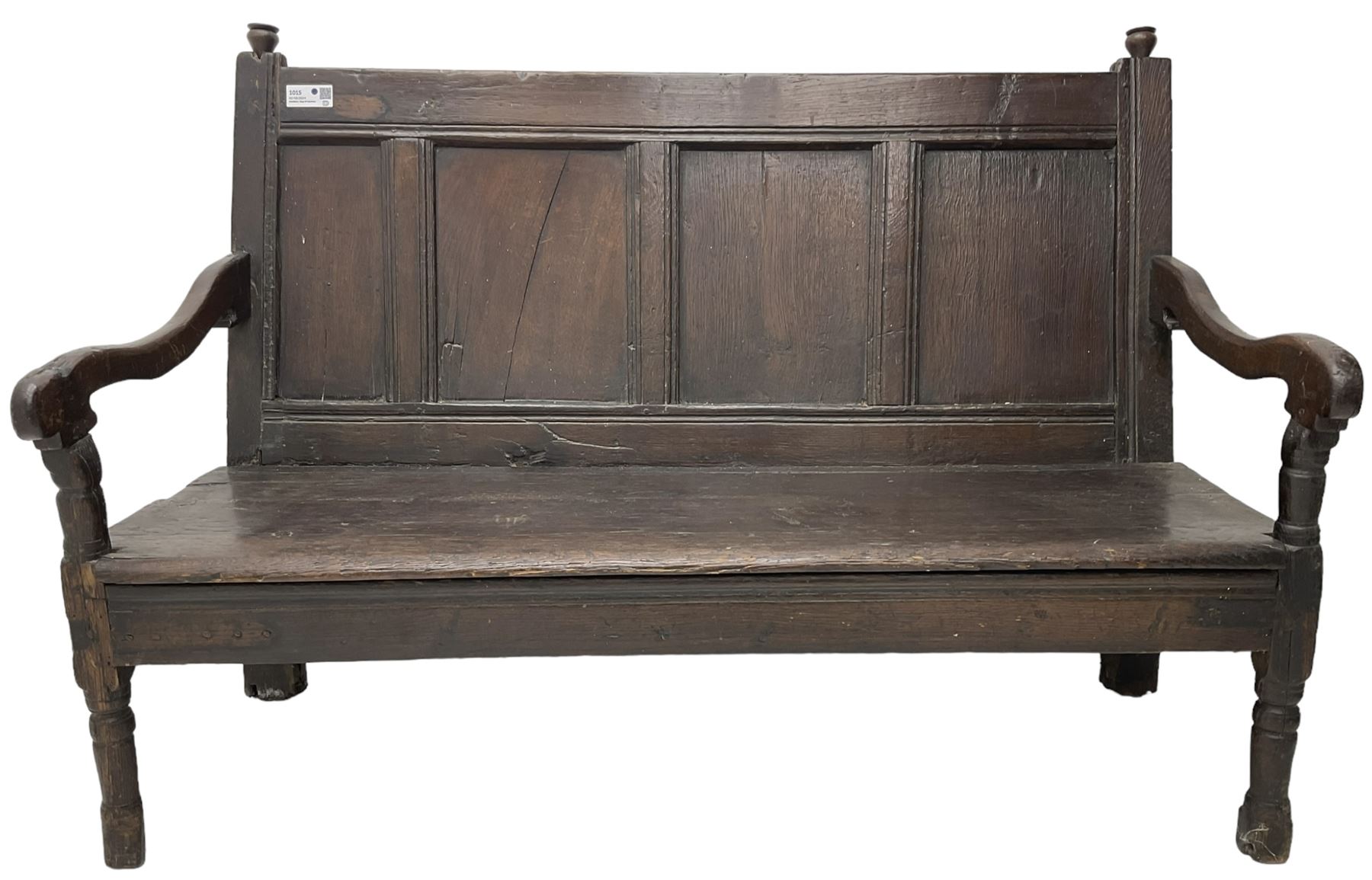 18th century oak hall bench or settle, quadruple panelled back with moulded rails, over a solid seat, raised on front turned supports