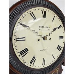 Frodsham of London - 8-day chain driven twin fusee wall clock in a mahogany case c1870, veneered case inlaid with brass stringing and motifs, shaped earpieces and chisel shaped base with pendulum adjustment door, 10” painted steel dial with Roman numerals, minute track and blued serpentine steel hands, dial inscribed Frodsham, Gracechurch Street, London, chain fusee, five-pillar, rack striking movement striking the hours on a cast bell. With pendulum.
H65 W34 D18
George Edward Frodsham, son of John Frodsham is recorded as working in Gracechurch Street, London 1869-79. Succeeded to Frodsham & Baker
