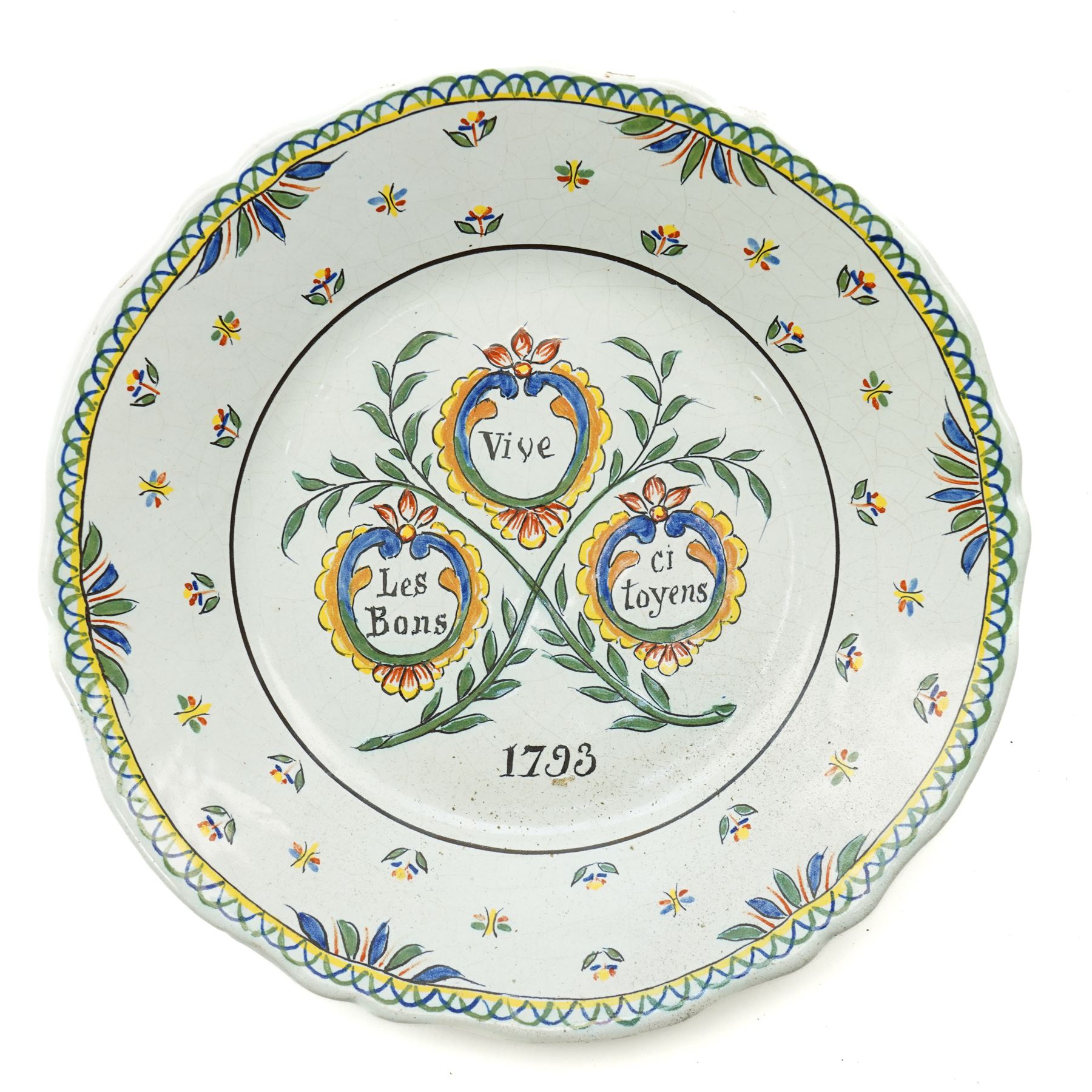 Set of four French Nevers style revolutionary faience plates, the first painted with a portrait of 'Evêque de Meaux' or the Bishop of Meaux,  another decorated with a putto holding a flaming torch and a flag inscribed 'W Lamour' beneath a slogan 'Cest le moment de faire un petit enfant' or 'Now is the time to make a child', another decorated with 'Vive les bons citoyens' or 'Long live the good citizens' within foliage, and another with a portrait of an officer, probably Napoleon, with the phrase 'Vive la Nation' or 'Long live the Nation', each bearing dates, with indistinct blue monogram to bases, D24cm (4)
