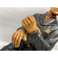 Large painted composite figure of Charlie Chaplin, seated upon wooden chair, H54cm