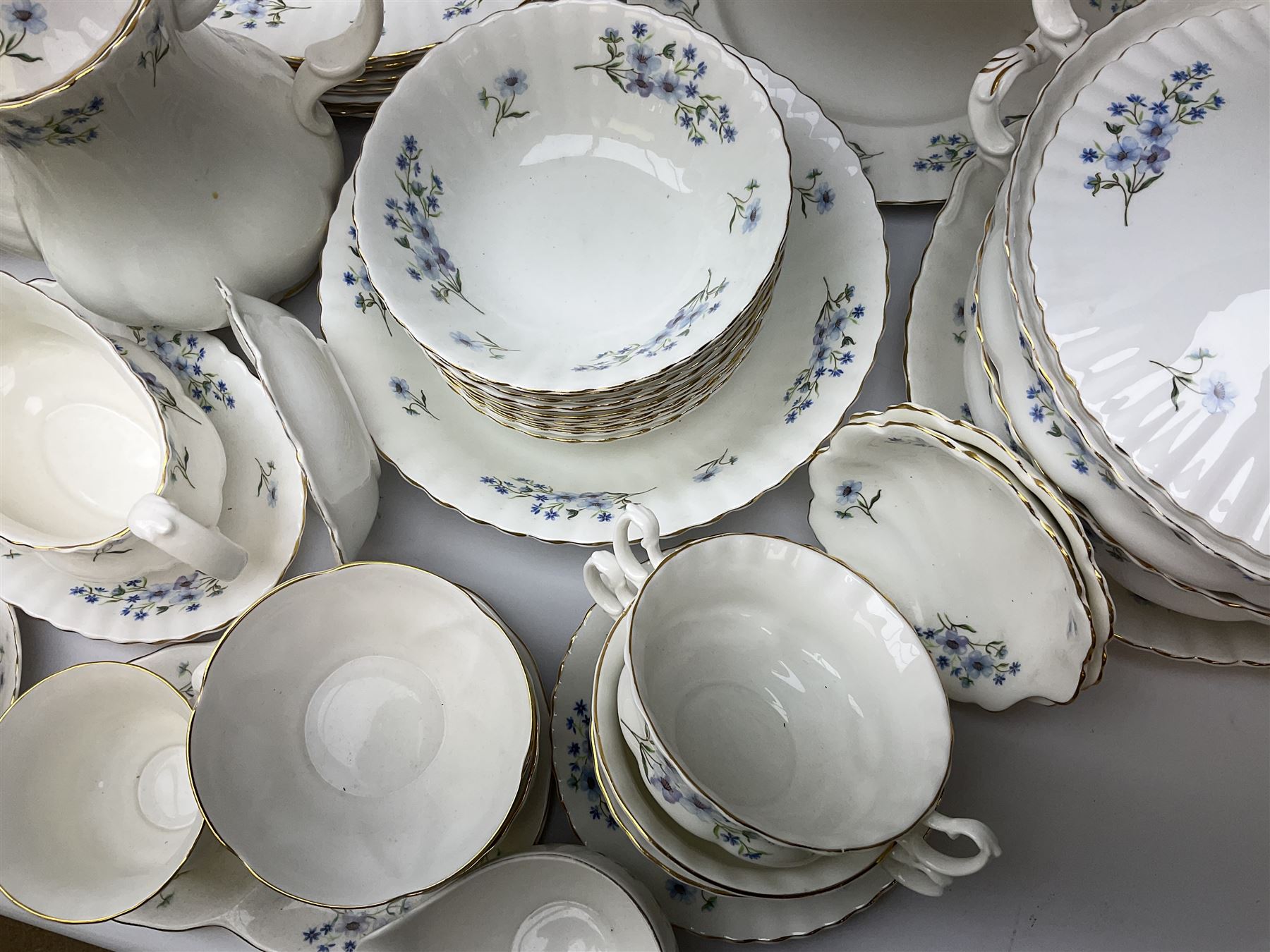 Extensive Richmond Blue Rock pattern part tea and dinner service, to include seven dinner plates, nine smaller plates, three lidded twin handled tureens, two teapots and two coffee pots, eleven bowls, cake stand, six twin handled soup bowls and saucers, six teacups, four coffee cups, milk jugs, sucrier, cake plate, salt and pepper shakers, other plates, dishes, bowls, side plates and many spares etc