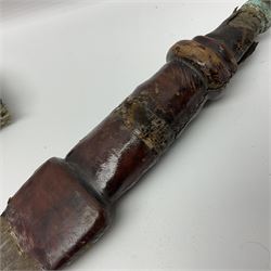 African Mandingo sword, the 75cm triple fullered blade with leather covered grip and brass pommel, in part leather covered scabbard with leaf shaped point L98cm overall