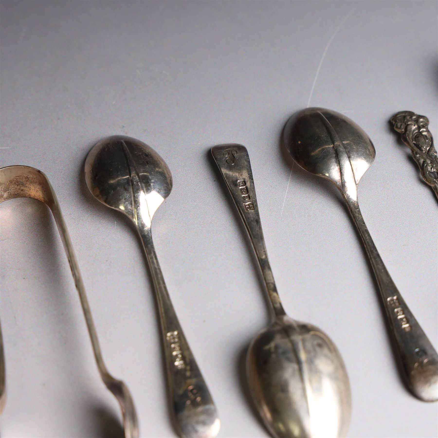 Set of six continental 800 silver coffee spoons with pierced rose design finials, stamped 800 verso, together with a cased set of six teaspoons and sugar tongs, with rattail bowls and engraved initials verso, hallmarked Cooper Brothers & Sons Ltd, Sheffield 1912, 