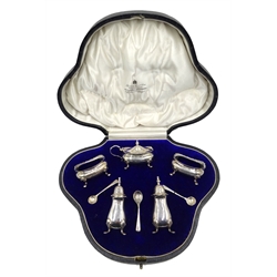  Silver five piece condiment set with matching spoons by E S Barnsley & Co, Birmingham 1911 with blue glass liners cased, approx 5oz  