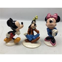Three Royal Doulton The Mickey Mouse Collection figurines comprising Mickey Mouse MM1, Minnie Mouse MM2, and Goofy MM5, together withe three Royal Doulton limited edition miniature snowman character jugs comprising Christmas Stocking Snowman D7124, Christmas Cracker Snowman D7158 and Snowman D7062, all with original boxes 