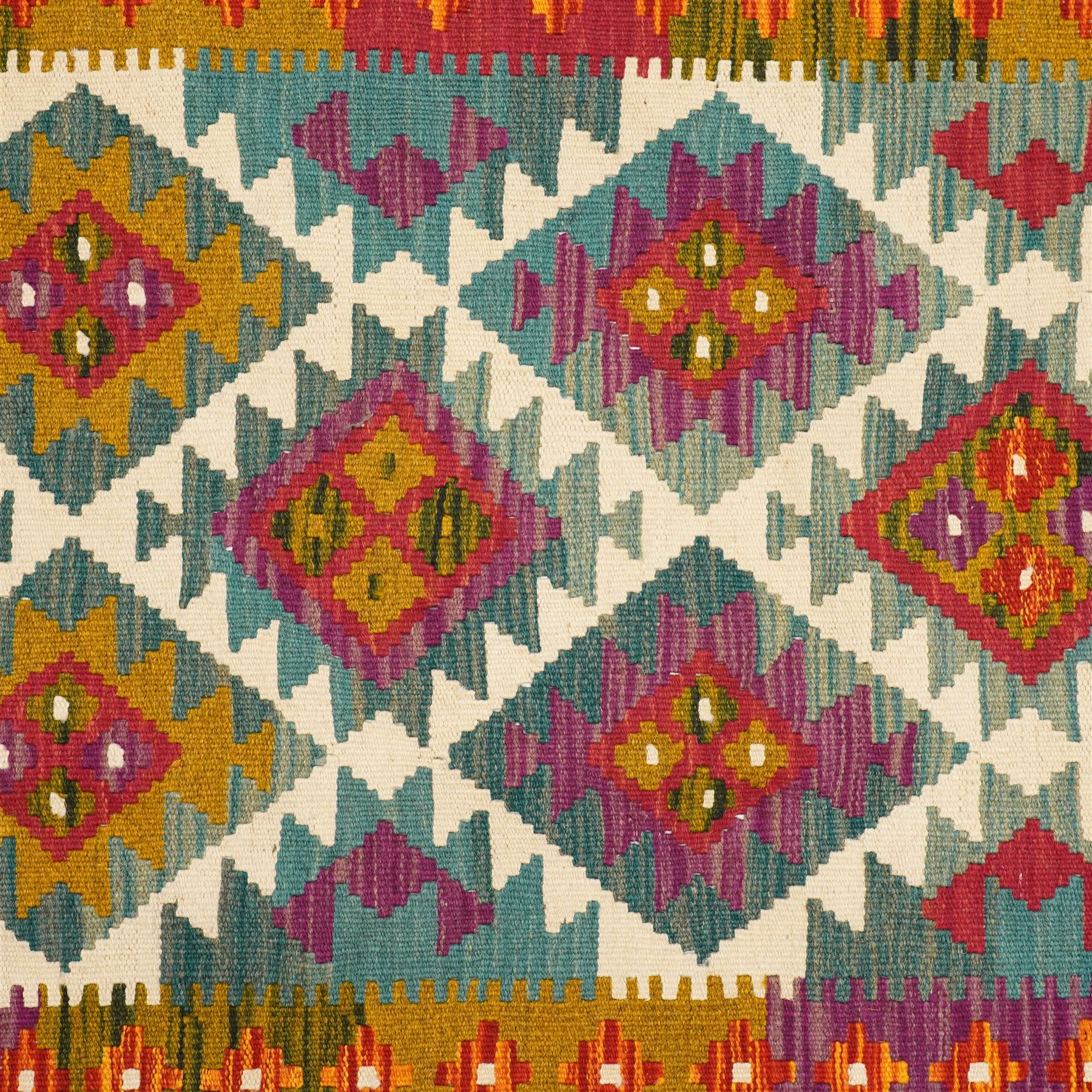 Afghan Maimana flatweave kilim runner, central field features large bold nested diamond motifs and stylized geometric lozenge patterns on olive purple, ochre, blue, and green tone ground, border stripe in orange and crimson ground, and fringe