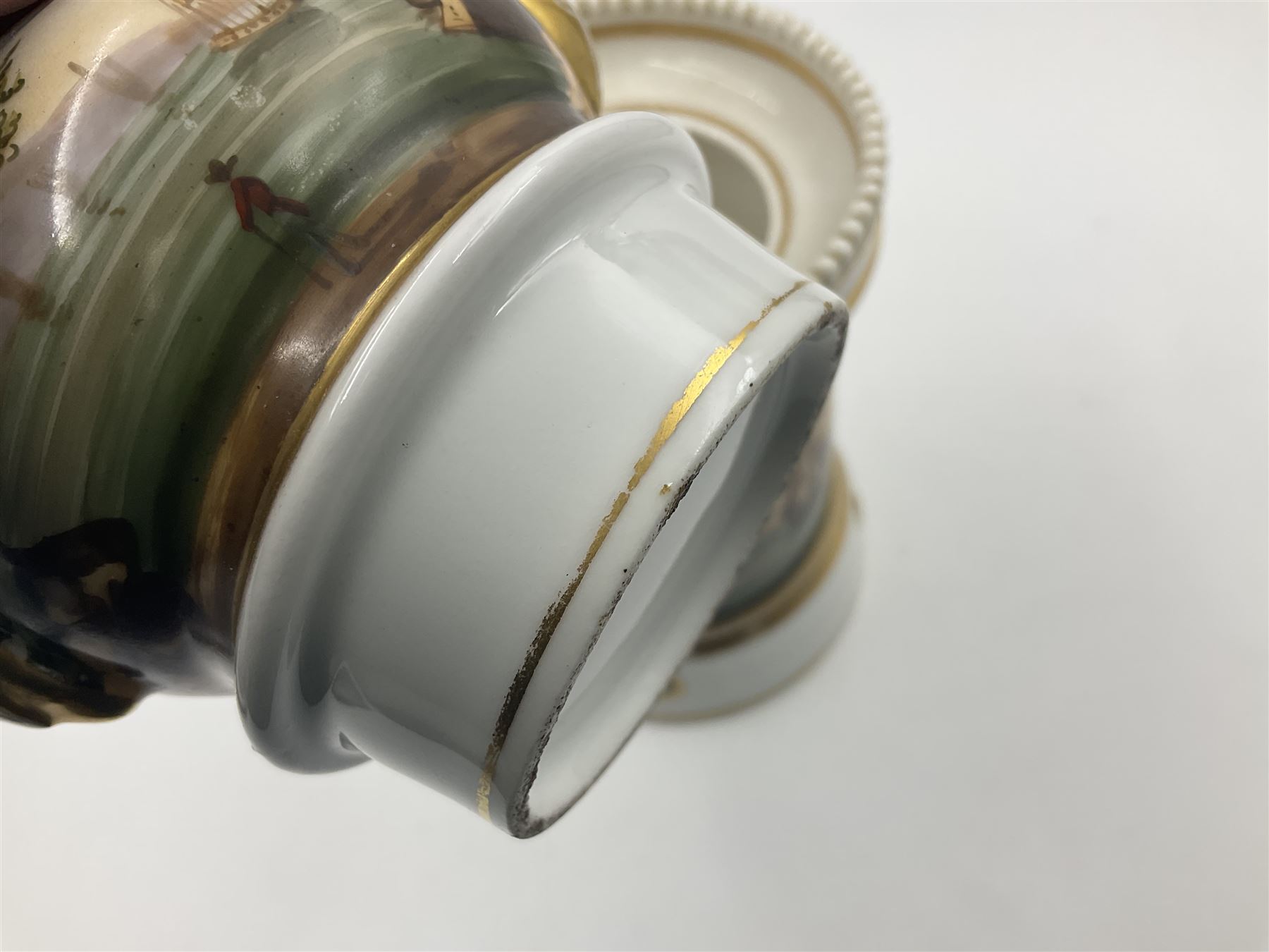 Two 19th century continental teapots and warmers, each teapot upon a cylindrical warming base, hand printed with seascapes, largest H22cm 