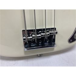 Fender Precision Bass guitar, in Olympic White finish with tortoiseshell effect scratchboard, serial no US15103092, in black Fender hard case with Fender strap and warranty card, guitar L116cm