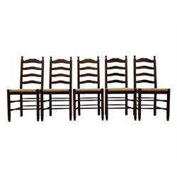 Set of ten 18th century design oak ladder back dining chairs, shaped cresting rail over four horizontal splats, rush seat raised on turned supports united by double stretchers