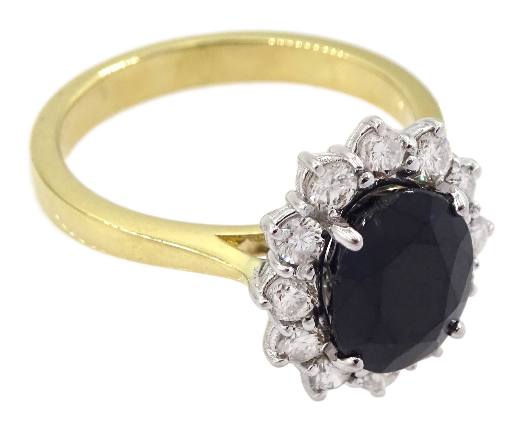 18ct gold oval sapphire and round brilliant cut diamond cluster ring, hallmarked, total diamond weight approx 0.55 carat, sapphire approx 2.60 carat