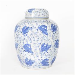 Blue and white ginger jar, decorated in a repetitive pattern of fish swimming amongst dense clusters of aquatic foliage, H40cm