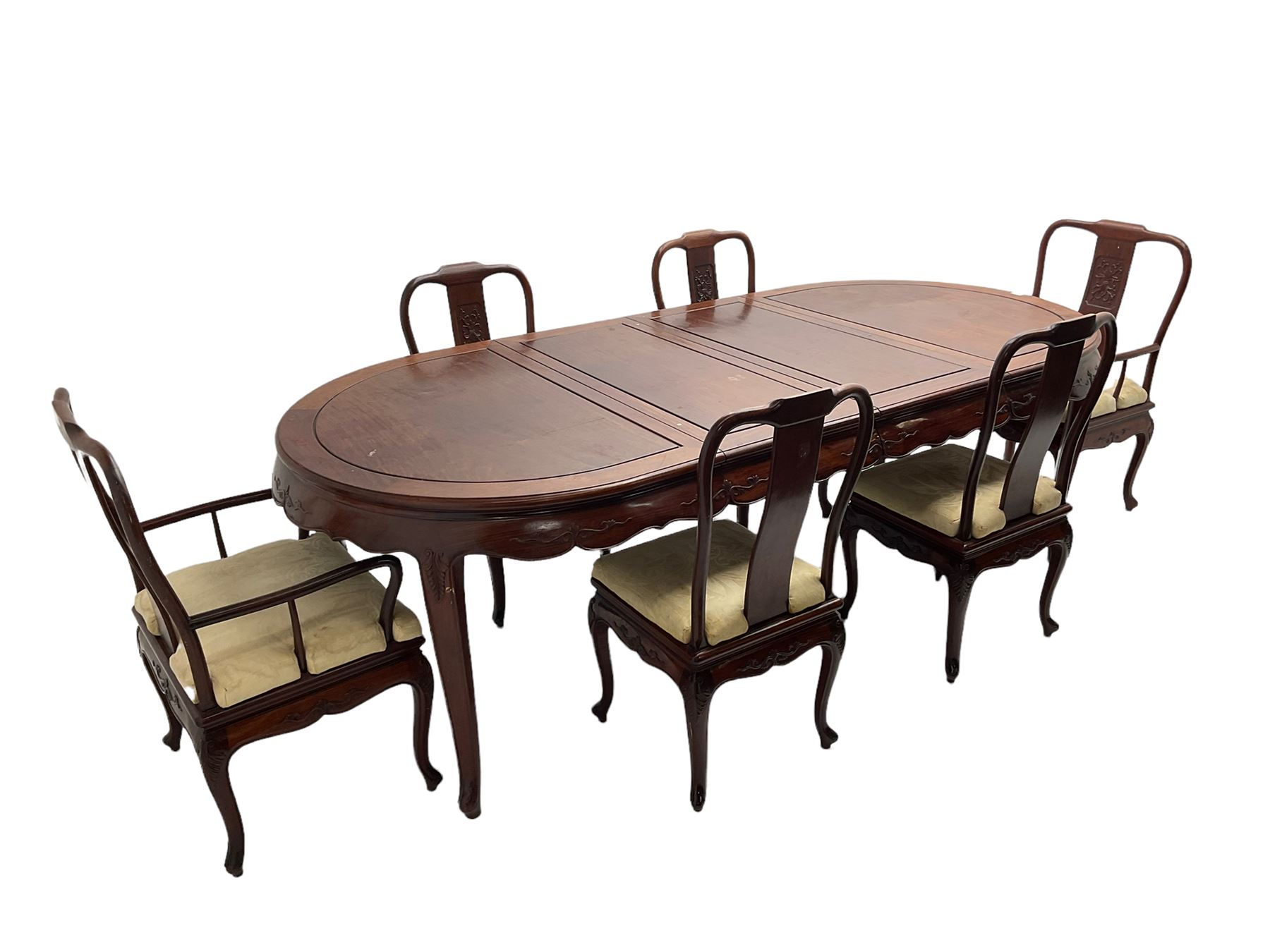 Mid to late 20th century Chinese hardwood extending dining table, two additional leaves, shaped apron carved with foliate scrolls, leaf carved cabriole supports (W246cm, H78cm, D117cm), and set six (4+2) dining chairs with shaped cresting rails over carved splats