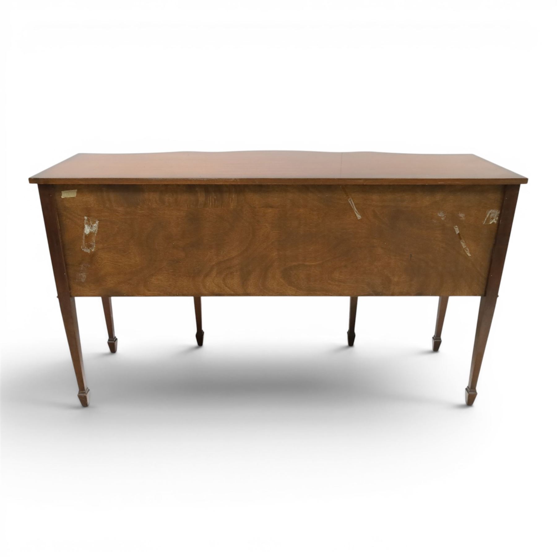 Georgian design mahogany serpentine sideboard, shaped top over two central drawers flanked by cupboard doors, flame mahogany veneered fronts with satinwood stringing, oval brass handles, shaped apron, on square tapering supports with spade feet