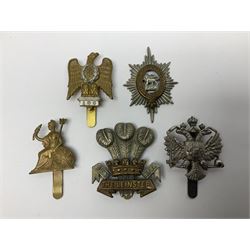 Twenty-one cap badges including 1st Queens Dragoon Guards, 14th/20th Kings Hussars, The Buffs, Royal Engineers, The Leinster, Cheshire Regiment, Kent Volunteer Fencibles etc (21)