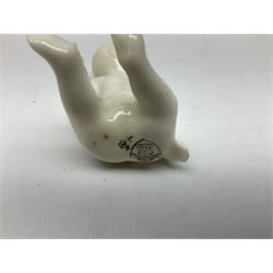 Collection of figural crested ware, to include Carlton Chins John Bull Alnwick, Clifton China Cheshire Cat,  Arcadia pig, Crafton crawling baby and another seated baby, quantity of cat, dog and pig figures, two Willow Art Model of Bunyans Statue, Toby jug, Victoria China, Arcadan bulldog, fish etc