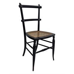 Late 19th century black-painted cane seat chair; early 20th century radial spindle-back chair with green upholstery; early 20th century mahogany single-drawer side table; mid-20th century carved wooden stool with harp motif; early 20th century hexagonal bamboo stand; two oval mirrors (7)