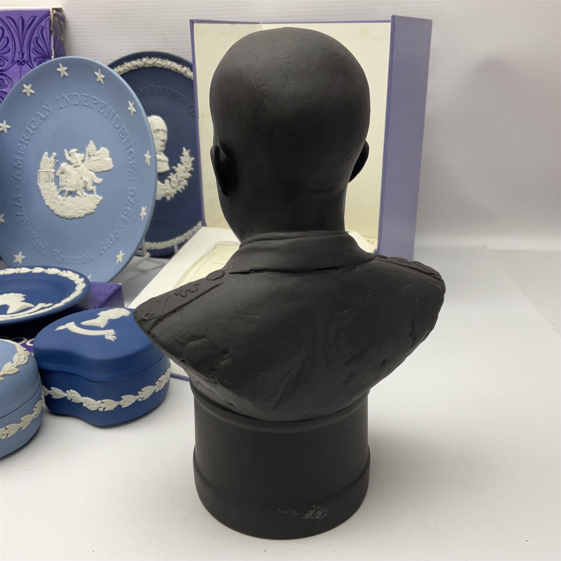 Collection of Wedgwood Jasperware, to include black Eisenhower Bust, two black basalt paperweights, one depicting an eagle and one depicting Julius Caesar, a blue Zodiac plate, Man on the Moon commemorative plate, American Independence Bicentennial plate and Royal commemorative ware, etc, all with impressed marks beneath, some with boxes