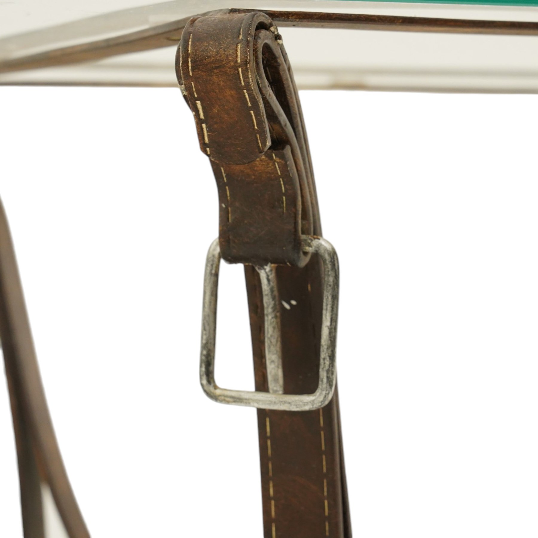 And So To Bed - 'Handel' side table with horse-tack style simulated leather wrought metal supports, rectangular glass top raised on shaped bridle-style supports united by shaped metal stretcher