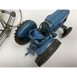 Chad Valley clockwork Fordson Major Tractor, a group of play worn Britains and other lead and metal farm animals, figures and accessories including a kennel, haystacks, dovecote, cows, sheep etc, together with a diecast model of a Tandem Bike L31cm