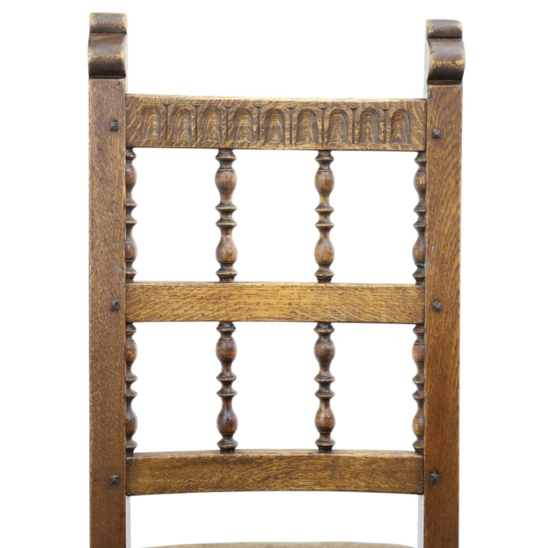 Rupert Griffiths for Monastic Woodcraft - oak 6ft refectory dining table with set six (4+2) matching chairs, rectangular top with arcaded frieze, with trestle base with further arcaded carved stretchers, chairs with carved rails and finials, leather wrapped seats with stud detail, turned supports united by carved stretcher