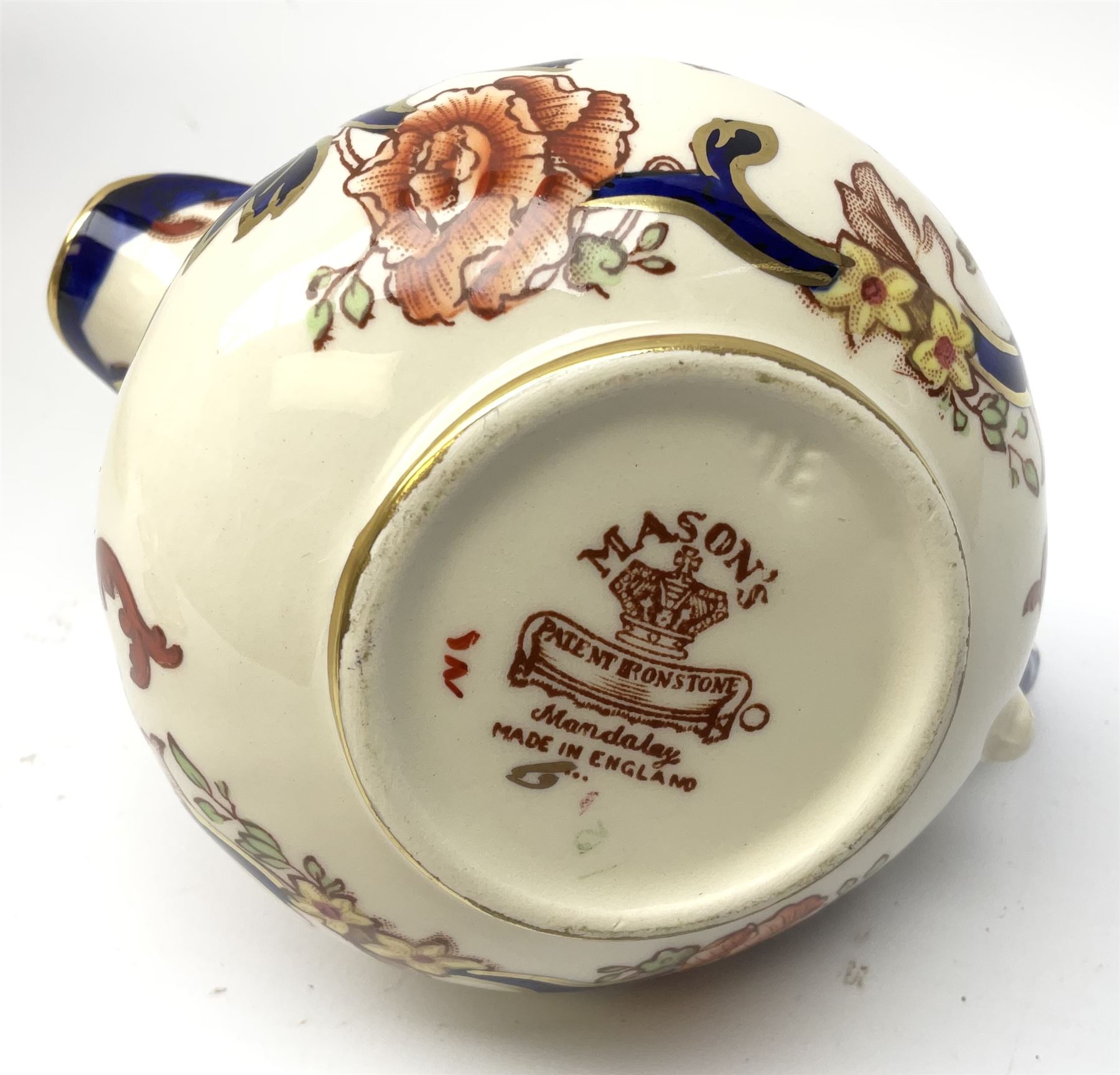 A group of Masons Ironstone Mandalay pattern wares, comprising large vase, planter with twin lug handles, three graduated plates, bowl, teapot, teacup and saucer, jug, smaller jug, open sucrier, small pot and cover, pair of candlesticks, small mantel clock, and pin dish. 