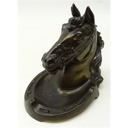  Early 20th century patinated spelter equestrian Inkstand, Horsehead cover hinged to reveal inkwell, on horseshoe base, H19cm, L19cm  