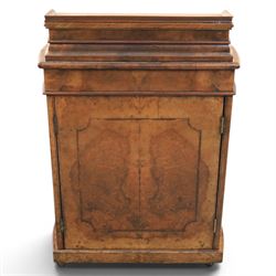 Victorian burr walnut Davenport, with hinged stationary top and slope, pull out writing surface with tooled green leather inset top, carved and turned front supports, flanked by two cupboard doors, raised on castors 