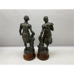 After S. Kinsburger, pair of early 20th century polished spelter figures of Lord Nelson and Arthur Wellesley, each depicted wearing full uniform and standing beside a rock; inscribed S. Kinsburger H39cm; on later turned mahogany bases H47cm overall (2)