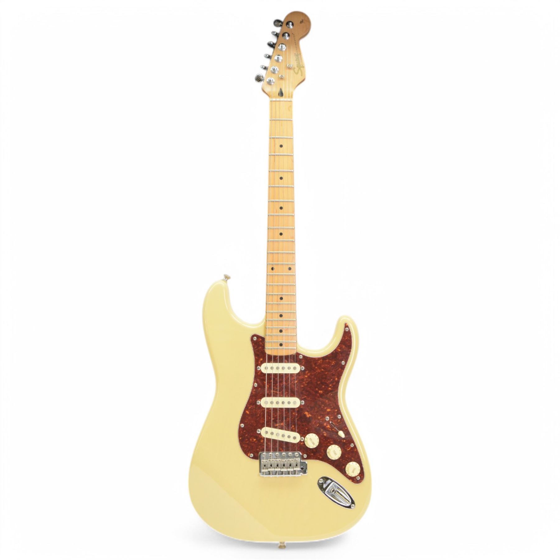 Squier by Fender Pro Tone Series Stratocaster electric guitar, in Olympic White finish, made in Korea serial no. 7034880, contained within a Fender soft case, guitar L98cm