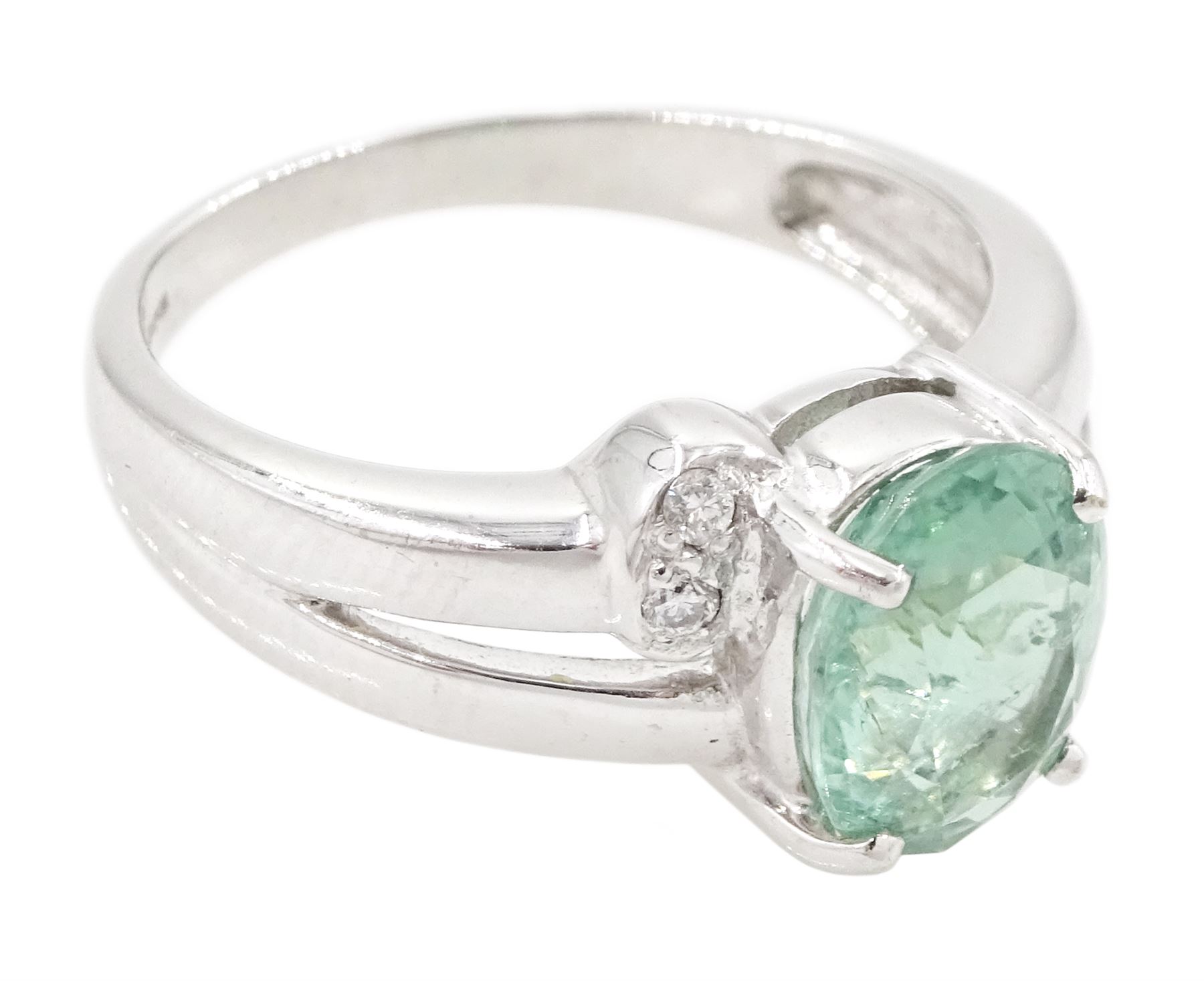 18ct white gold oval cut Paraiba tourmaline and round brilliant cut diamond ring, Birmingham 2006, tourmaline approx 1.80 carat