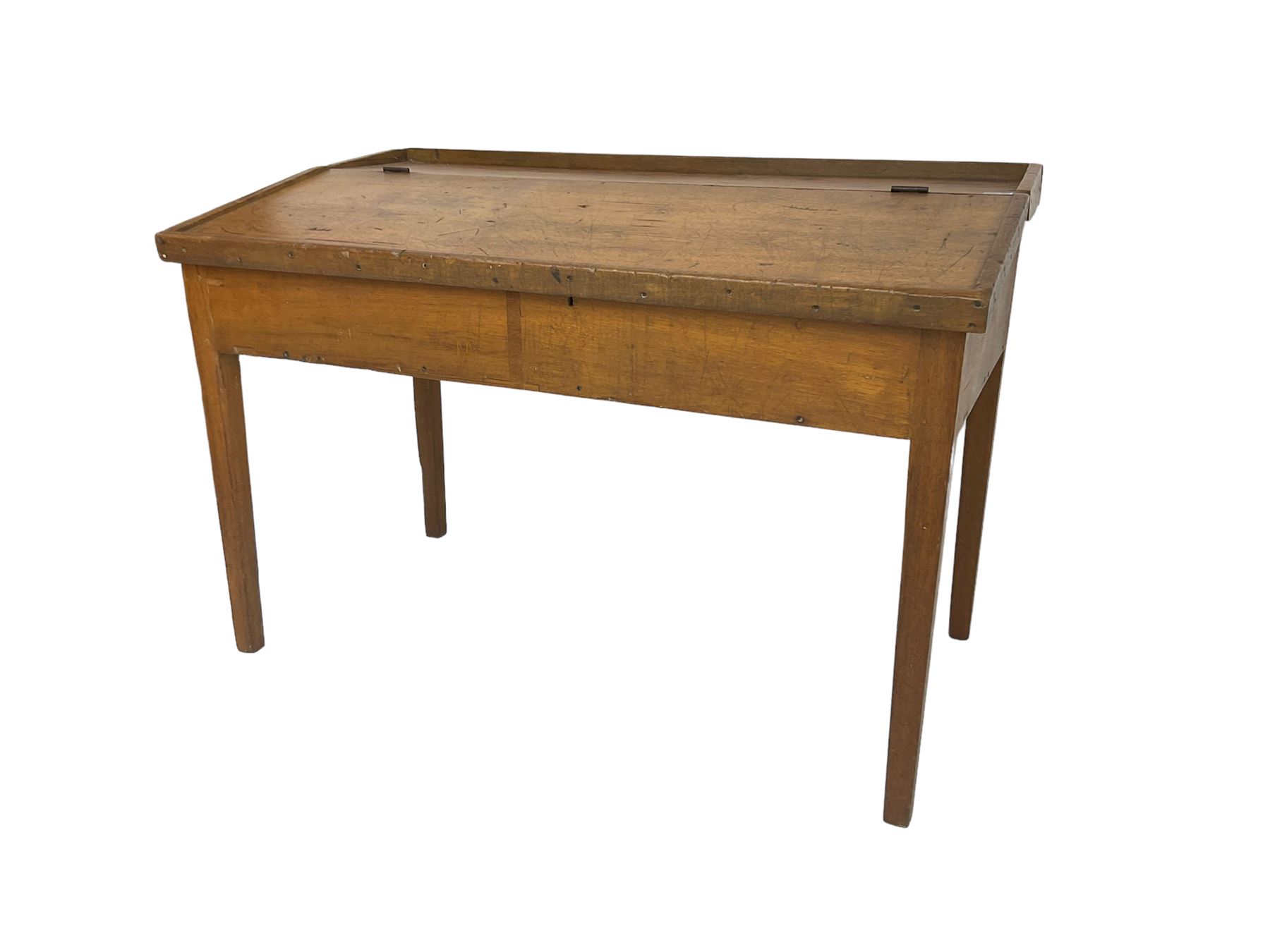 Late 19th century walnut school desk, sloped hinged lid, on square tapering supports 