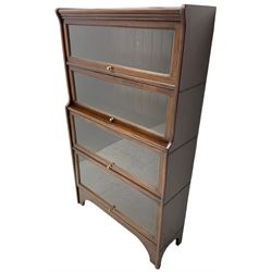 Kenric Efferson - early 20th century mahogany four-tier library bookcase, enclosed by four glazed up-and-over doors, on bracket feet