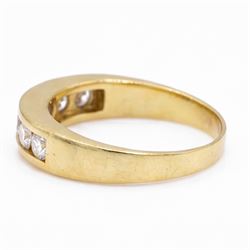 18ct gold diamond ring, channel set with seven round brilliant cut diamonds, hallmarked, total diamond weight 0.75 carat