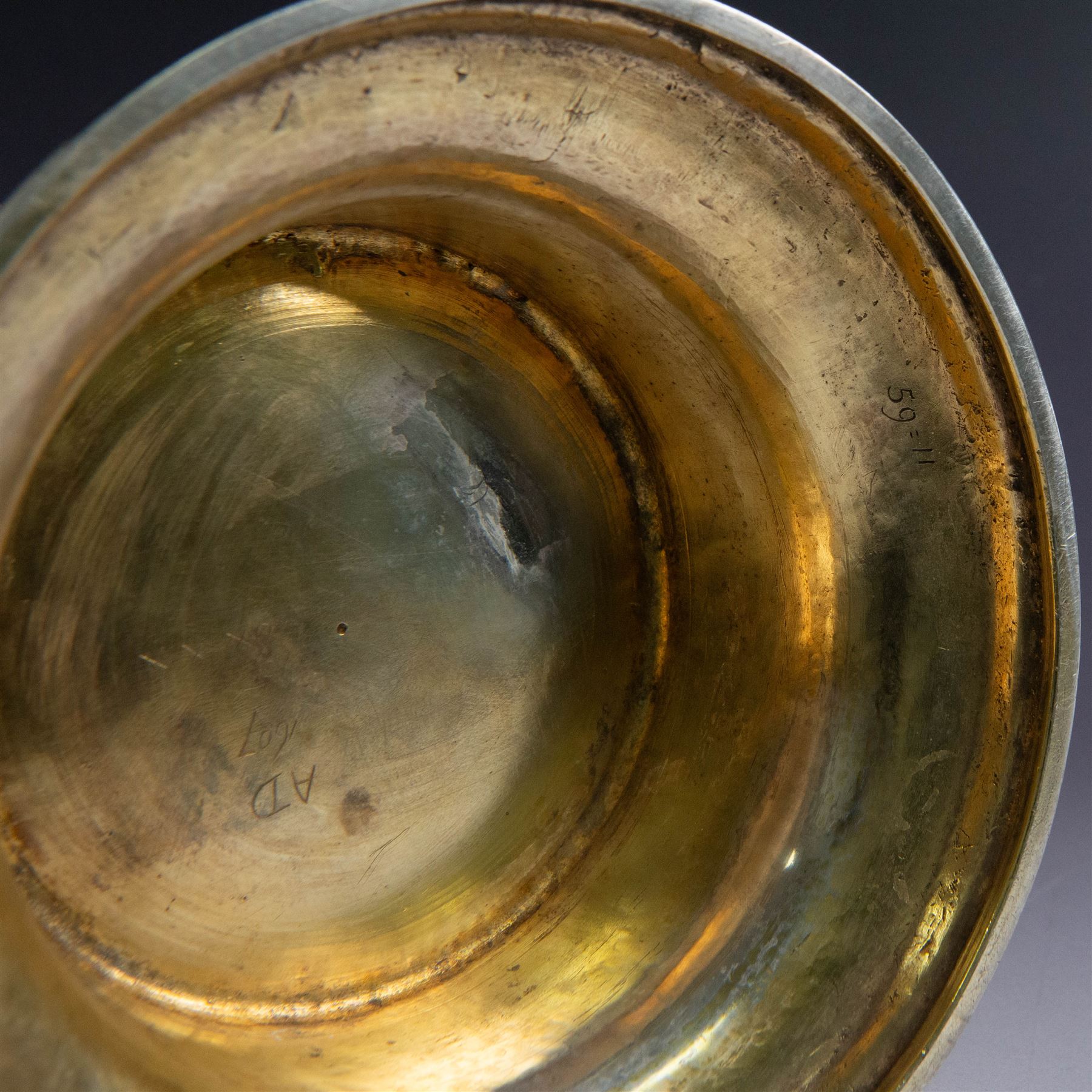 George I silver-gilt wine flagon, of tapering cylindrical form with part fluted body and upon circular spreading foot, with c-scroll handle, domed lid with rose to centre  and scroll thumb piece, hallmarked London 1725, maker's mark indistinct, with later refinements, the original hallmarks struck-through and re-assayed by the London Assay 2021, H33cm