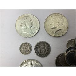 Approximately 215 grams of world coins, mostly in silver, including United States of America 1851 half dime, 1875 dime, three half dollars dated 1943, 1963 and 1964 etc 