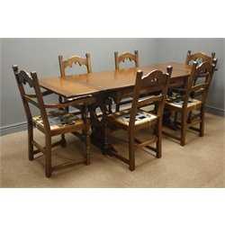  Bevan and Funnell Ltd oak extending dining table, pierced solid end supports joined by single stretcher on sledge feet, (229cm x 77cm, H78cm, maximum measurements) and six chairs (4+2) shaped cresting rail, turned supports  