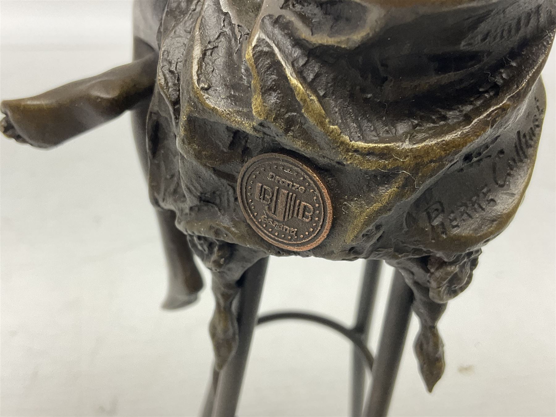 Art Deco style bronze modelled as a female figure seated upon a chair holding an apple, after 'Pierre Collinet', H28cm