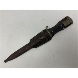 WWII German K98 (short) NCO dress bayonet, the 20cm fullered blade marked Anton Wingen Solingen to the ricasso, with chequered black grip plates; in steel scabbard with indistinctly stamped leather frog |L37cm overall