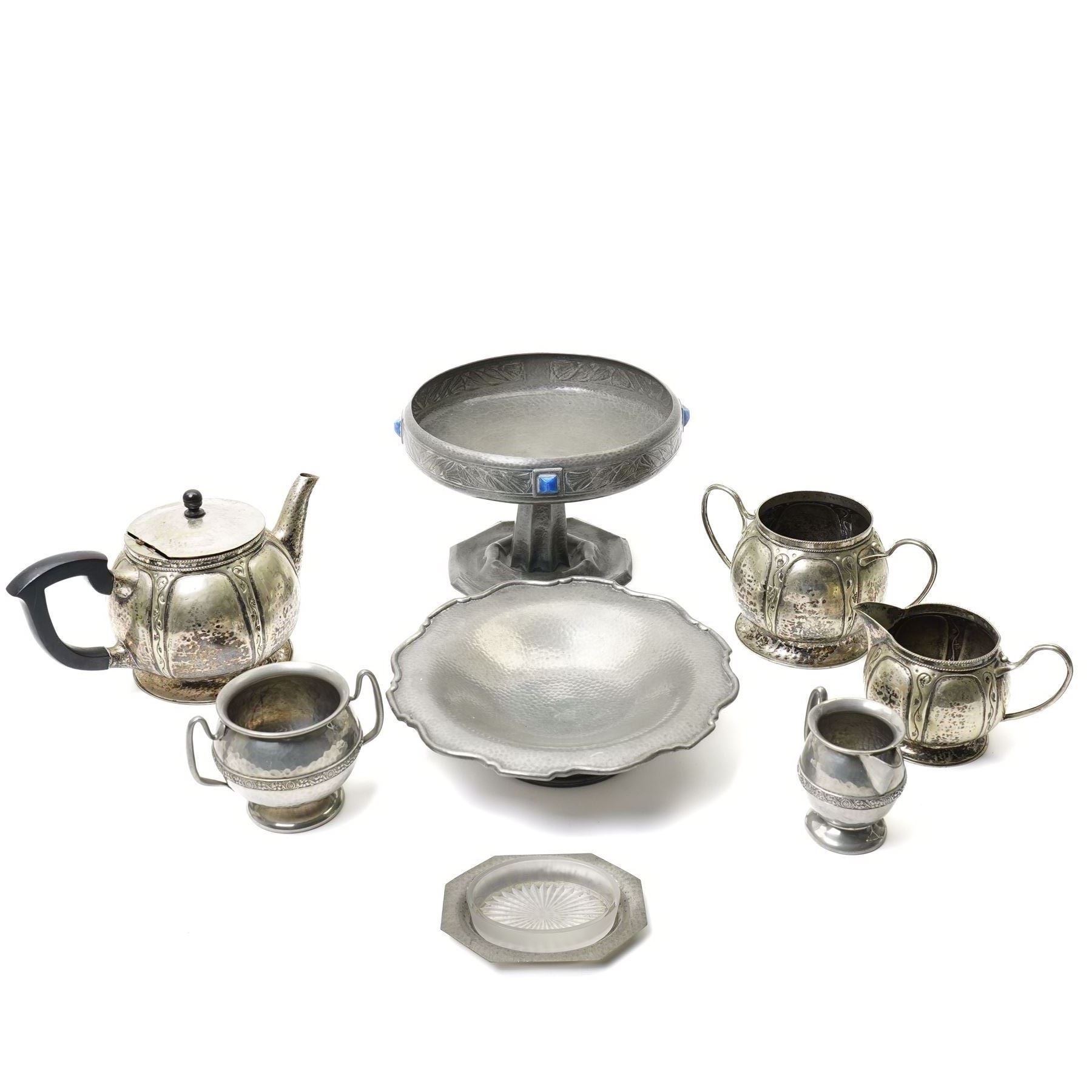 Early 20th century Arts & Crafts fruit dish by Walter Somerfield of the Leicester Art School, H16.5cm; silver plated tea service with trailing floral decoration, and various other hammered pewter items (8)
